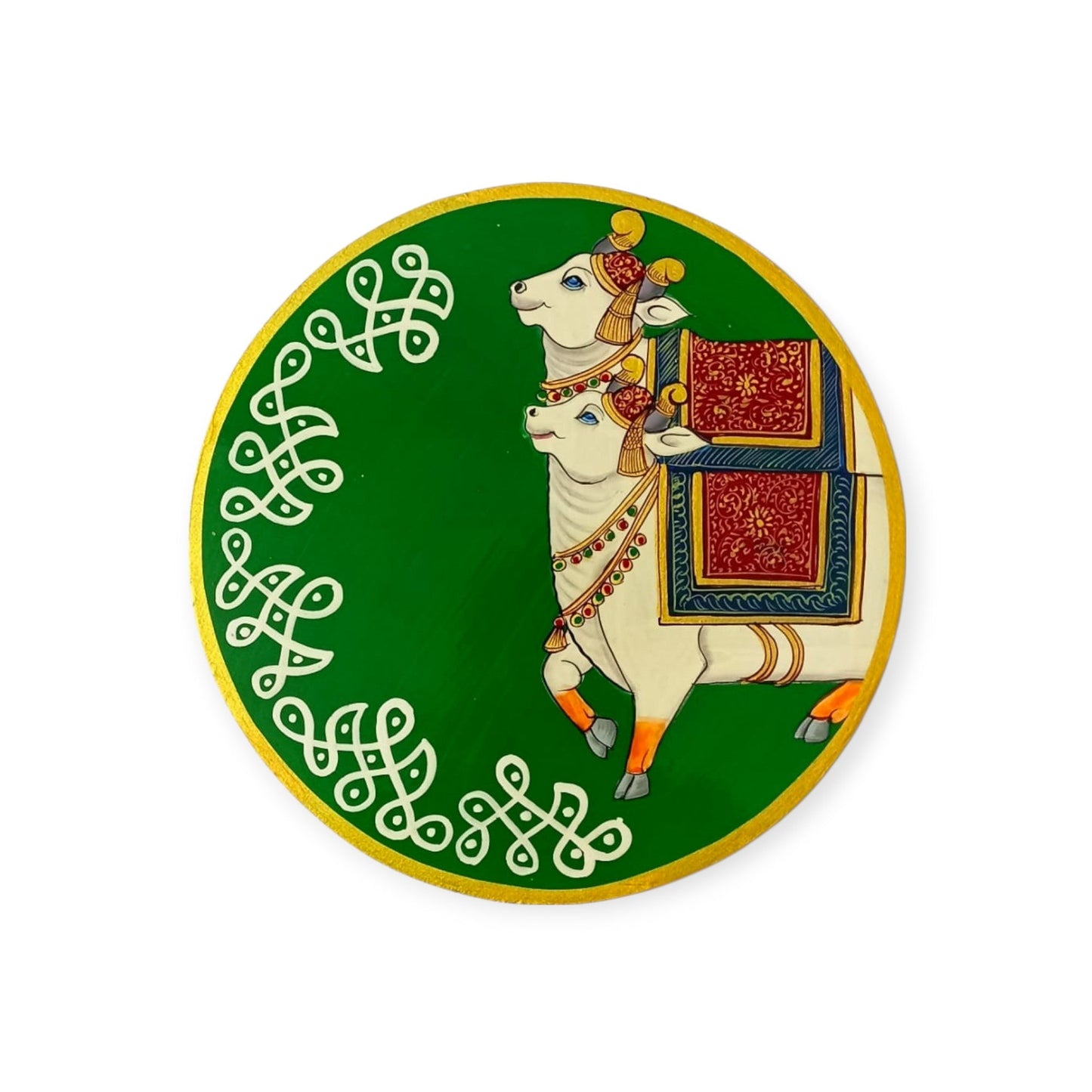 Decorative plate with a cow and decorative elements on a green background
