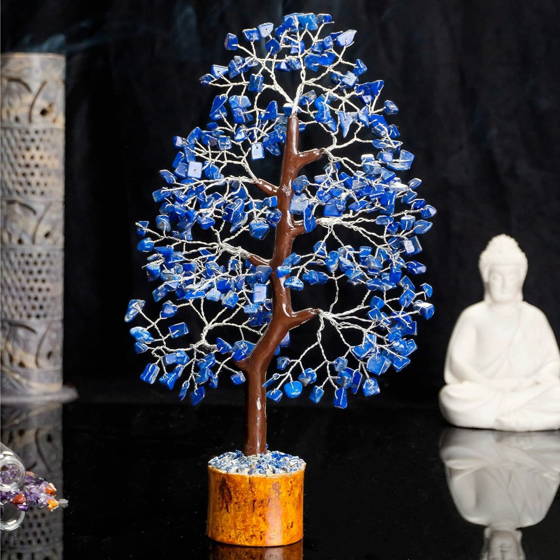 Decorative tree with blue stones on a dark background