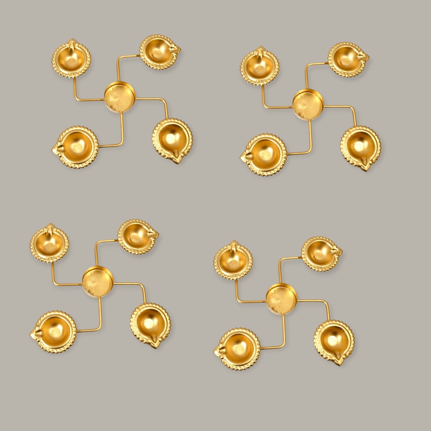 Set of gold earrings on a gray background