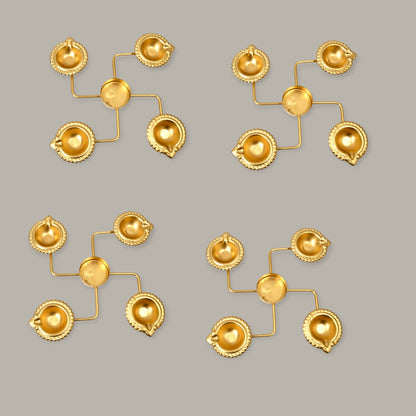 Set of gold earrings on a gray background