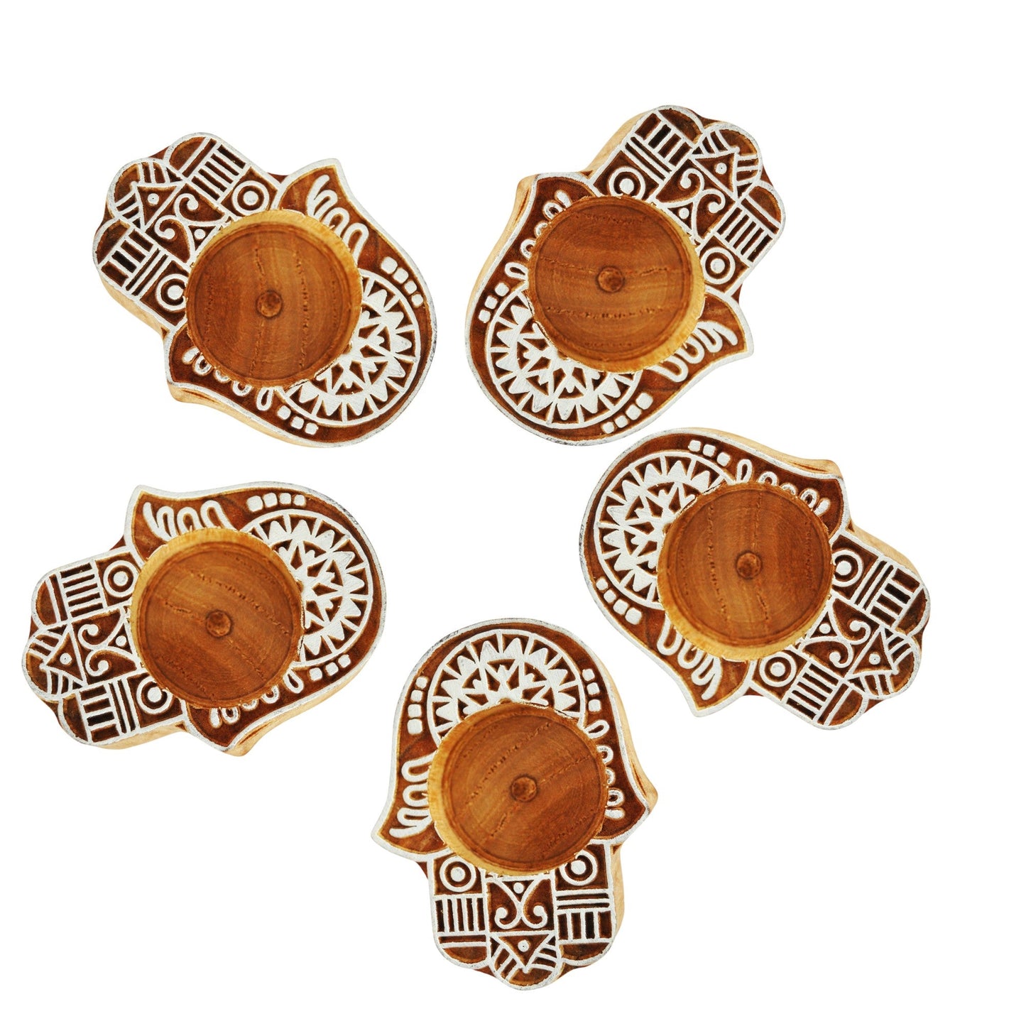A set of small wooden hand block diya with intricate geometric patterns, painted in brown and white color scheme.